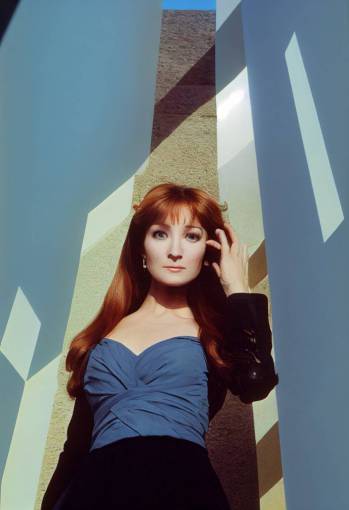 upward camera view, low angle camera view Jane Seymour standing on steps looking down at camera