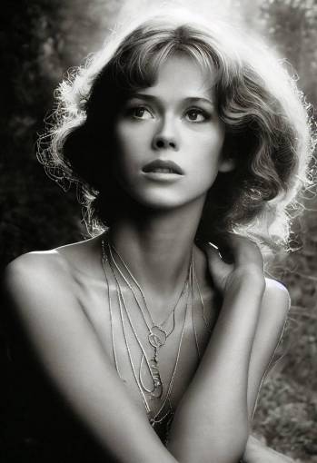 young Jane Fonda at a thermal spa with touselled hair, light make up, small silver necklace, diffuse morning light, steam rising from limpid waters, by Paolo Eleuteri Serpieri, Luis Royo, Paolo Roversi, 120mm lens,