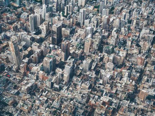 drone view of a city, Brutalist architecture,sharp focus,telephoto lens,digital art 4k