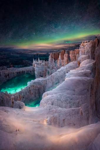 arctic icey bryce canyon made entirely of ice, with aurora in the sky above, atmospheric, 20 mm lens, epic, dramatic, 8k, photo realistic
