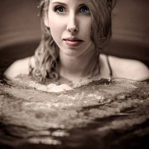 photographic portrait by Annie Leibovitz of AMOURANTH in a hot tub, closeup, foggy, sepia, moody, dream-like, sigma 85mm f/1.4, 15mm, 35mm, 4k, high resolution, 4k, 8k, hd, full color